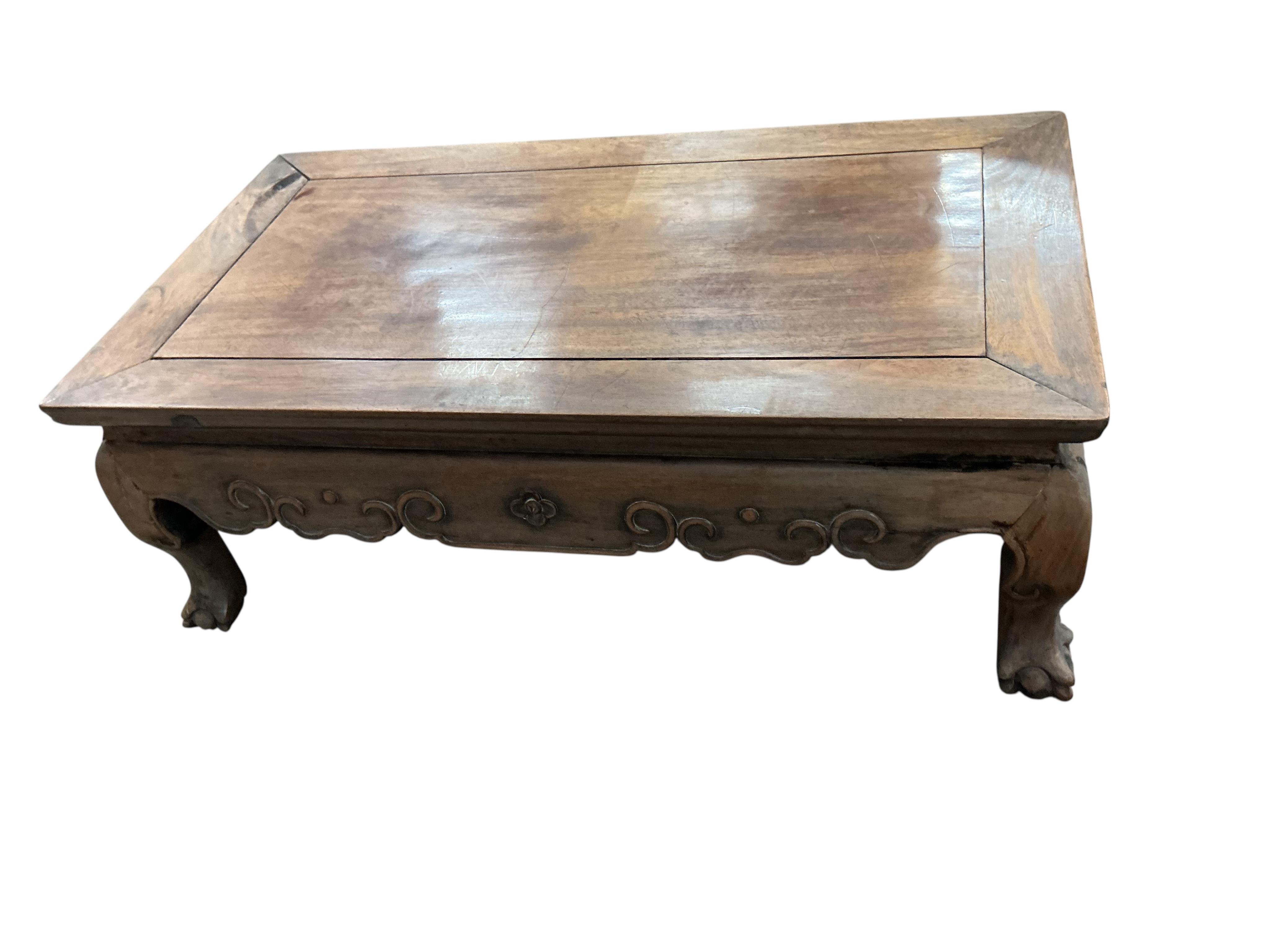 A Chinese rectangular hongmu low table, faded, width 77cm, depth 42cm, height 28cm